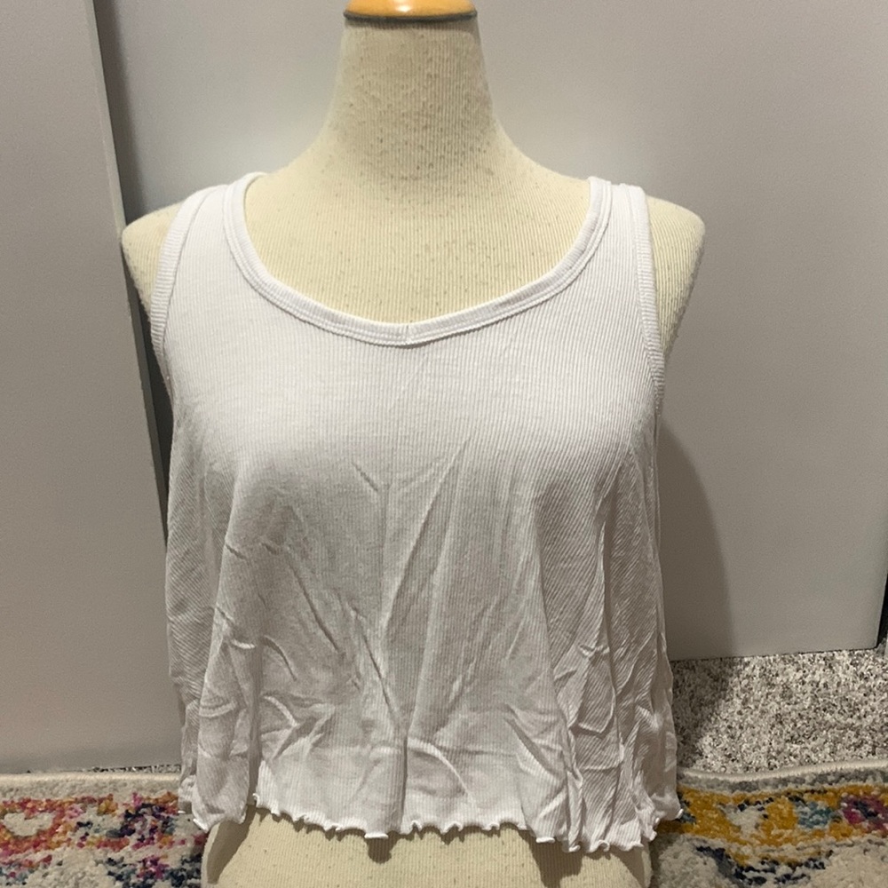Brand: So. Size small. White flowy tanktop. Ruffled at bottom
